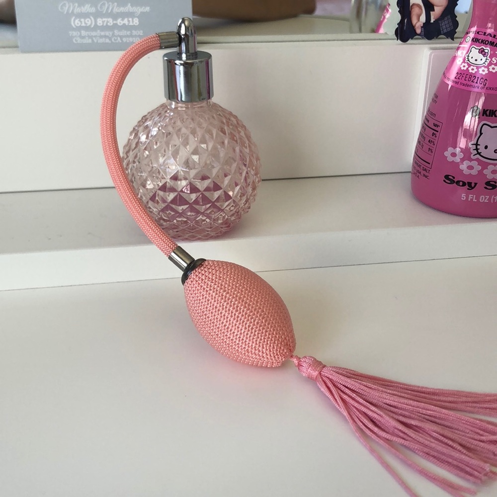 an empty vintage perfume bottle